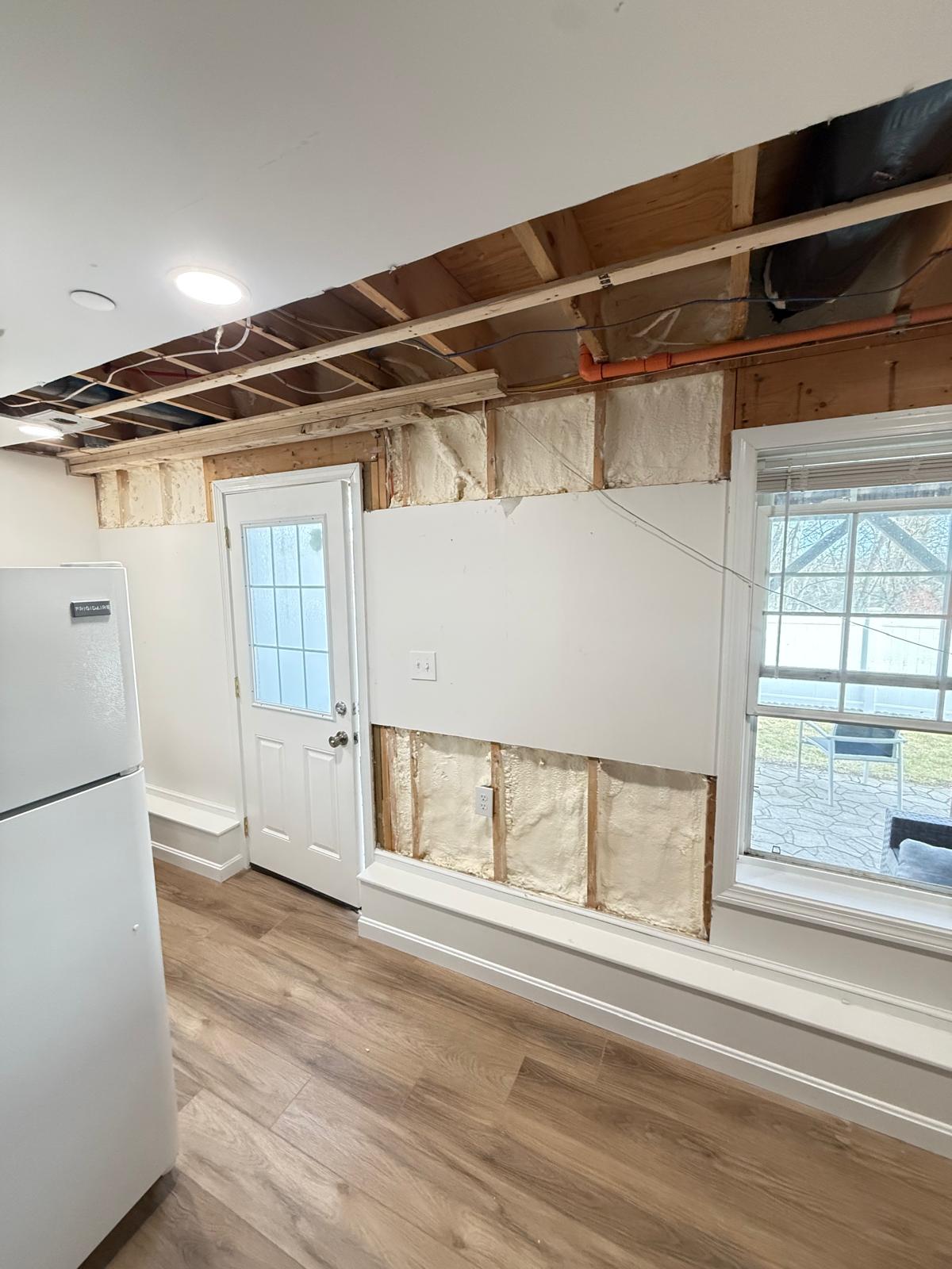 Fiberglass insulation professionally installed between wall framing